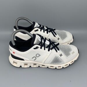 On Running White and Black Athletic Shoes